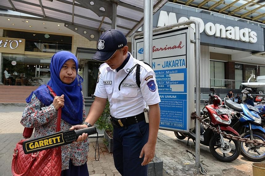 An armed policeman standing guard in Jakarta last Friday. The police's call for more funding to support its war on terror follows the Jan 14 attack by four local militants in Central Jakarta. "This is for anticipating threats from terrorists, regardl