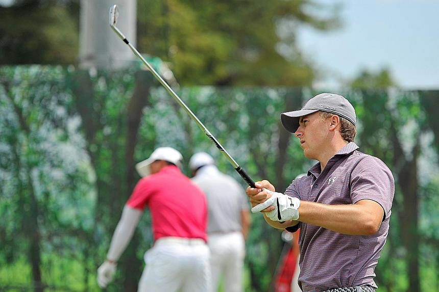 Reigning world No. 1 Jordan Spieth testing his mettle at the challenging Serapong Course yesterday. The Texan golfer, who has never competed in the Republic before, is favoured to win the 50th edition of the Singapore Open which gets under way today.