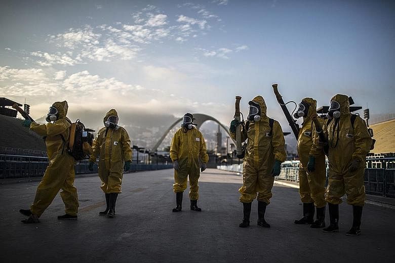 Workers fumigating the Sambadrome ahead of carnival celebrations in Rio de Janeiro, Brazil, on Tuesday. Epidemiologists warn that the Rio Carnival could serve as a catalyst for spreading Zika as tourists gather in cities during the peak breeding seas