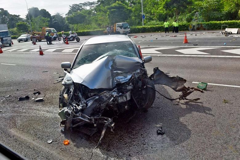 2 injured after car crashes into lorry on SLE; impact flips lorry ...