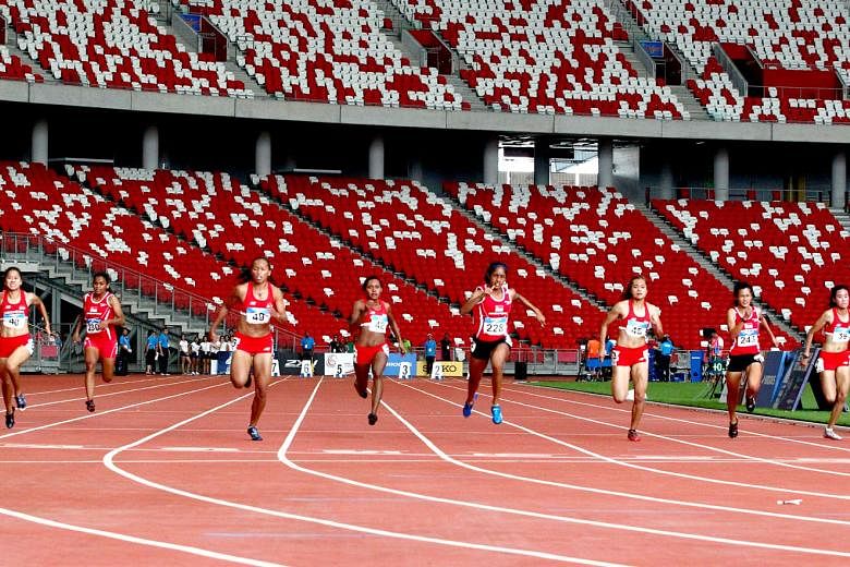 Shanti Pereira (fifth from left) finishing second in the women's 100m final at the Singapore Open Track and Field Championships at the National Stadium last year. 