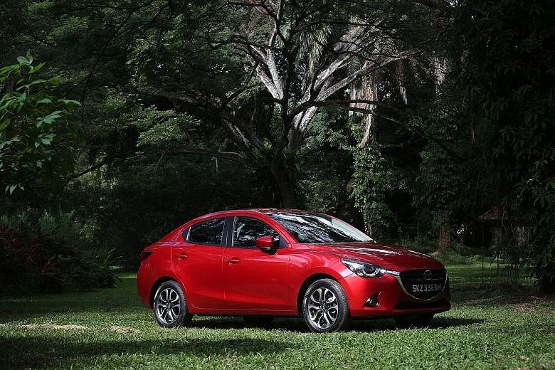 The roof of the Mazda 2 Sedan slopes all the way back to meet the boot.