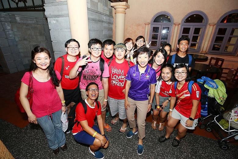 Minister for Culture, Community and Youth Grace Fu (in purple polo shirt) with volunteers of last month's Asean Para Games at an appreciation event held at Universal Studios Singapore last night. An estimated 3,500 volunteers were treated to a specta