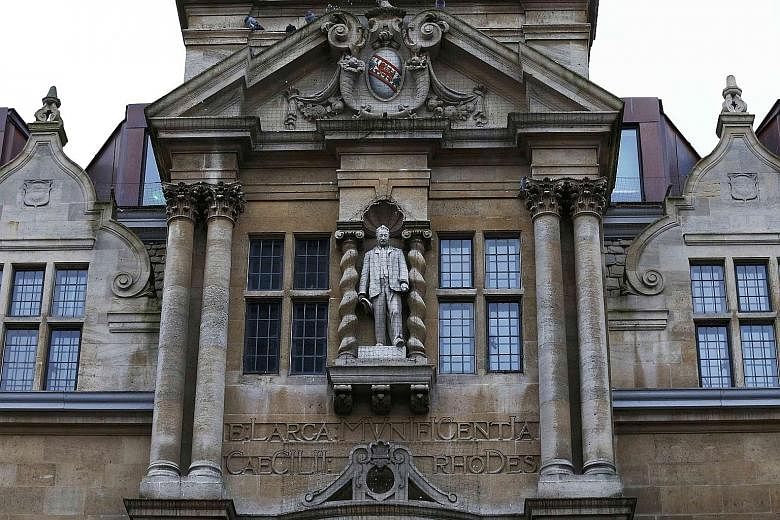 The statue of Cecil Rhodes is seen on the facade of Oriel College in Oxford, southern England. Many current students are objecting to the presence of the statue of the white supremacist empire-builder in the heart of the historic city, inspired by th