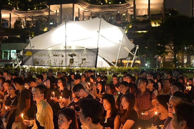 The vigil in October 2014 in Hong Lim Park to support protesters in Hong Kong fighting election restrictions, over which Mr Jolovan Wham was issued a police warning. According to Mr Wham's lawyer Choo Zheng Xi, the judge cut the legal costs sought by