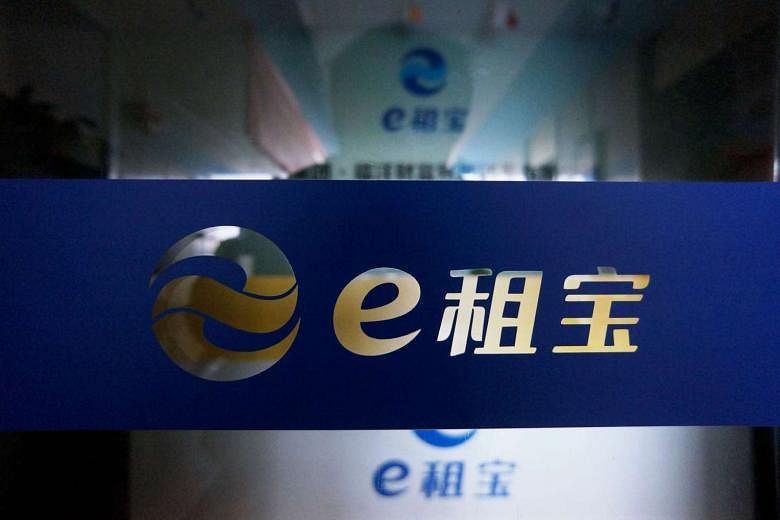 The logo of peer-to-peer lender Ezubao at its padlocked office in Hangzhou on Dec 17, 2015.
