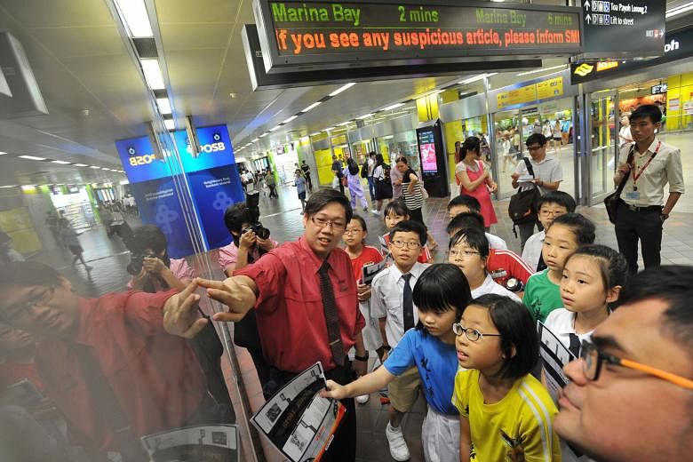 Pupils from Pei Chun Public School (above) being taught about train station operations during a training session at Toa Payoh MRT station last month. The SMRT's Adopt-a-Station initiative, which began in September 2014 and currently has 21 schools taking 
