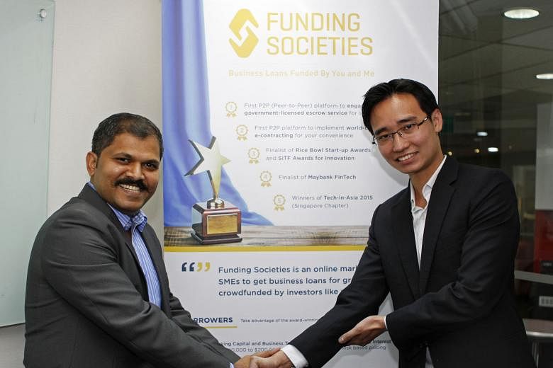 Mr Karuppaiah Palani, who owns an Indian restaurant, with Mr Teo, co-founder of crowdfunding platform Funding Societies, which gave the SME a loan.
