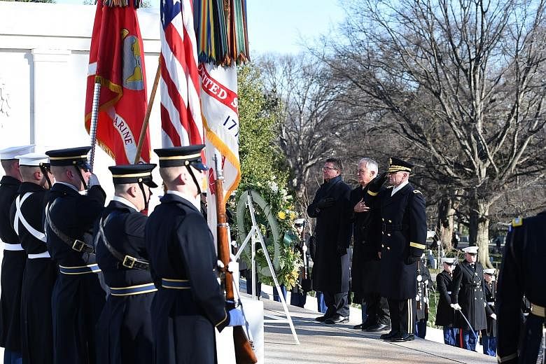 (From left) US Secretary of Defence Ashton Carter, Australian PM Malcolm Turnbull and escort Major-General Bradley A. Becker at the Tomb of the Unknowns in Arlington National Cemetery in Virginia on Jan 18.