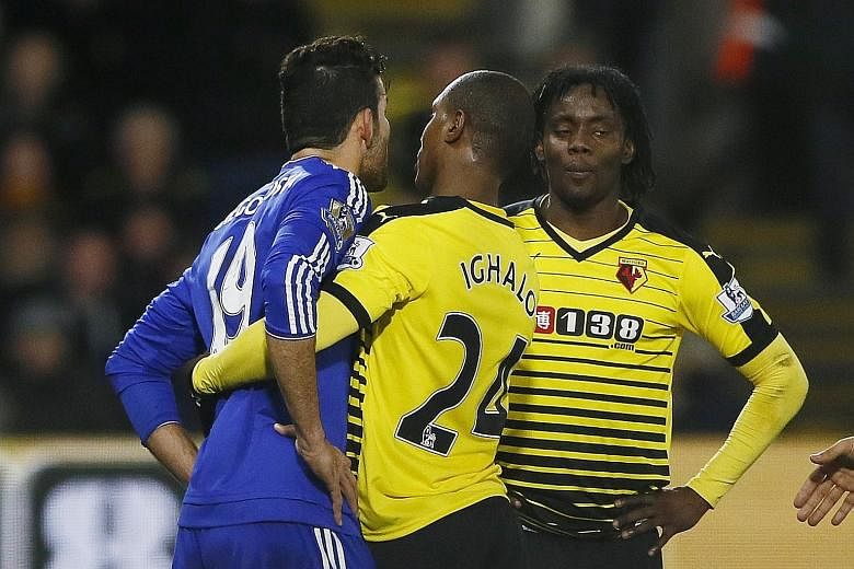 Odion Ighalo trying to intervene after Chelsea's Diego Costa (left) tussled with Juan Carlos Paredes, who was booked later.