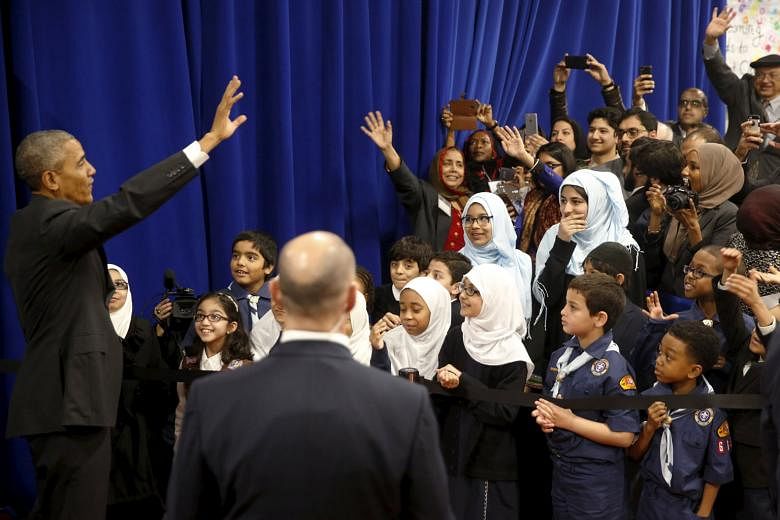 Mr Obama at the Islamic Society of Baltimore in Catonsville, Maryland, on Wednesday. It was his first visit to a mosque in the United States as President.