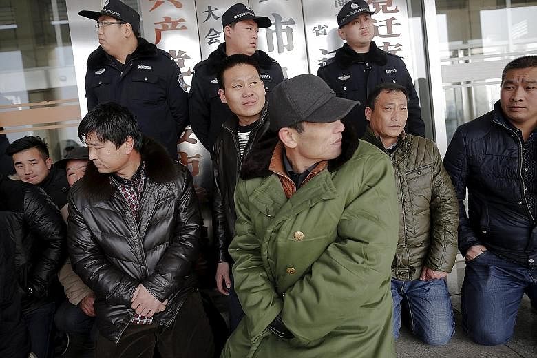 Chinese migrant workers protesting over unpaid wages in front of a local government office in Qian'an city in Hebei province last week. Data from Hong Kong-based group China Labour Bulletin shows that in December and last month, there were 774 labour