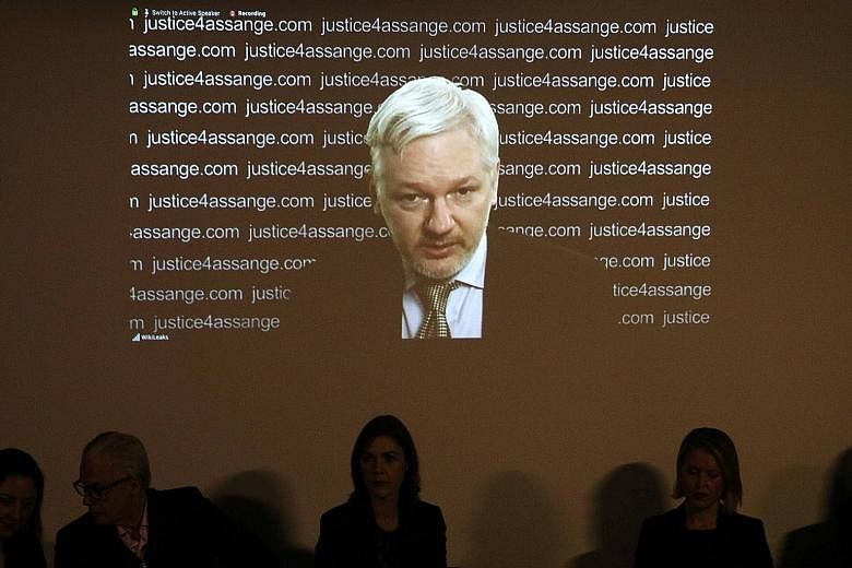 WikiLeaks founder Julian Assange appearing via video link during a news conference at the Frontline Club in London yesterday, where he hailed a UN finding as a "significant victory".