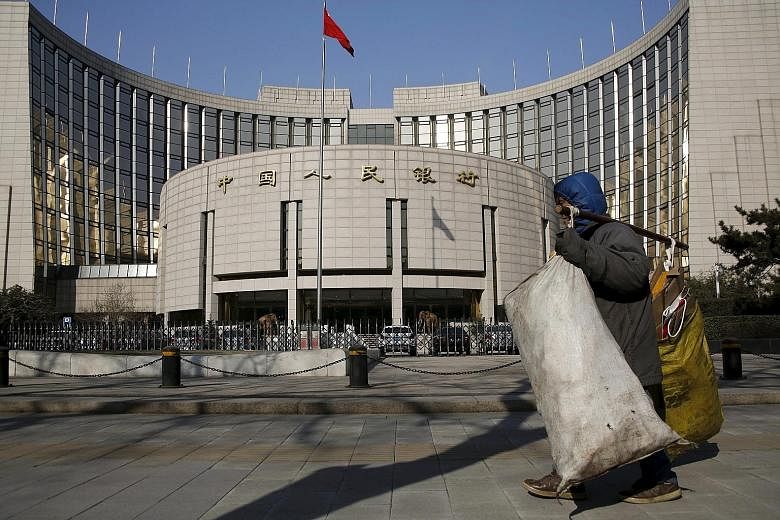 China's foreign reserves are continuing to decline amid a deepening economic slowdown, a weakening yuan and plunging stocks. The People's Bank of China (left) has stepped up efforts to stem the exodus.
