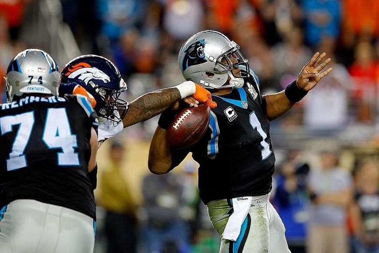 From top: Super Bowl 50's Most Valuable Player, the Denver Broncos' Von Miller, strips the ball away from Carolina Panthers' star quarterback Cam Newton, forcing a fumble that led to a Denver touchdown, in the first quarter. A sullen Newton barely an