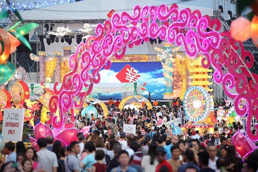 Above left: In line with the Year of the Monkey, the decorations included elements of Journey To The West, a classic Chinese story featuring the Monkey God, seen here in the form of a large sculpture. Above right: This year's River Hongbao, which sta