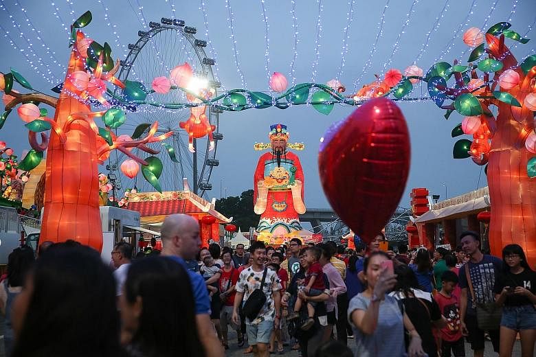 Above left: In line with the Year of the Monkey, the decorations included elements of Journey To The West, a classic Chinese story featuring the Monkey God, seen here in the form of a large sculpture. Above right: This year's River Hongbao, which sta