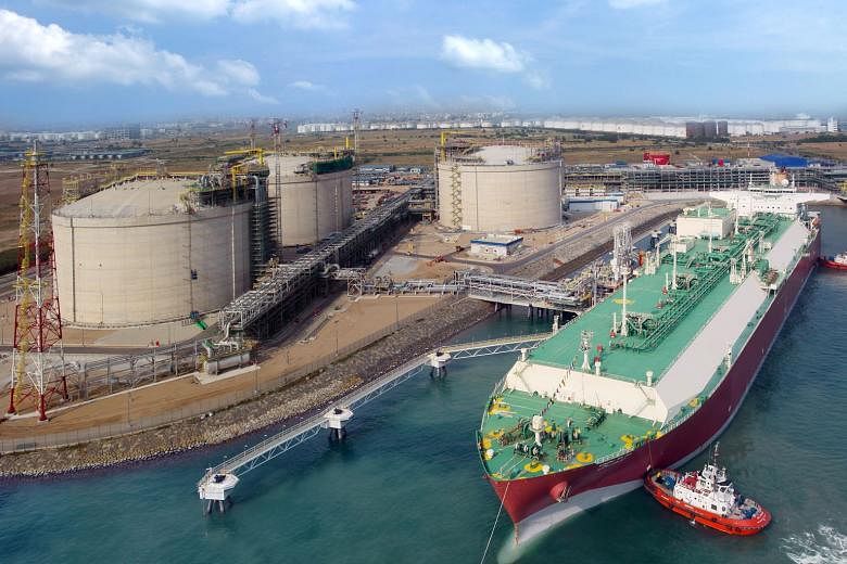Singapore LNG Corp's liquefied natural gas terminal receiving its first cargo of supercooled natural gas in 2013. It will have a throughput capacity of 11 million tonnes by next year, when its fourth storage tank is up and running.