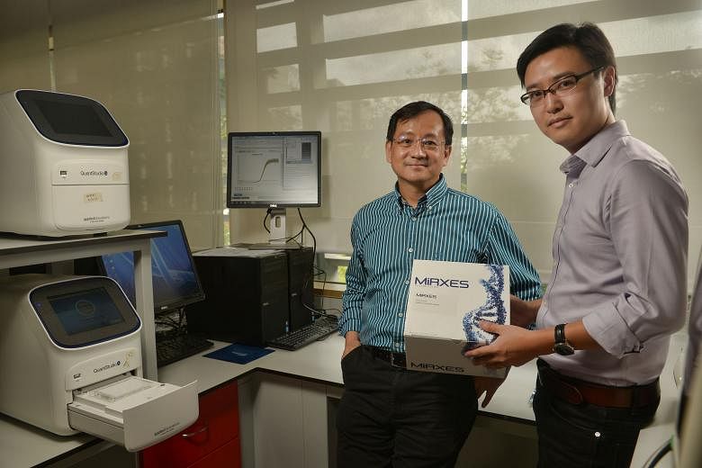 Dr Too (left) and Dr Zhou with their diagnostic kit. 