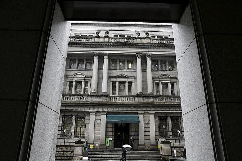 The Bank of Japan's headquarters in Tokyo. It is too early to assess if negative interest rates will work well for economies like Japan and the European Union.