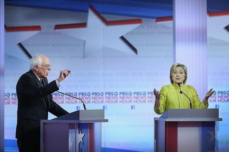 Senator Bernie Sanders and Mrs Hillary Clinton during their latest debate in which the tensions between the Democrat rivals became increasingly obvious.