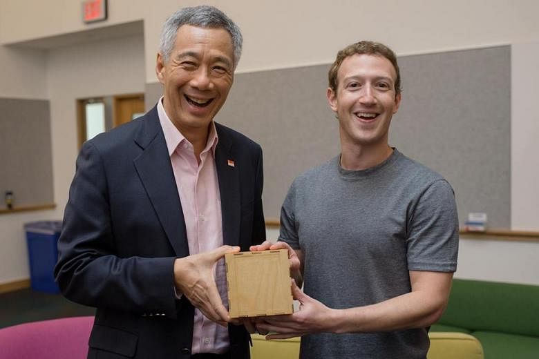 Facebook founder Mark Zuckerberg presented PM Lee with an artwork etched with lines from a computer program he wrote when they met at the social network's headquarters in Menlo Park on Feb 12.