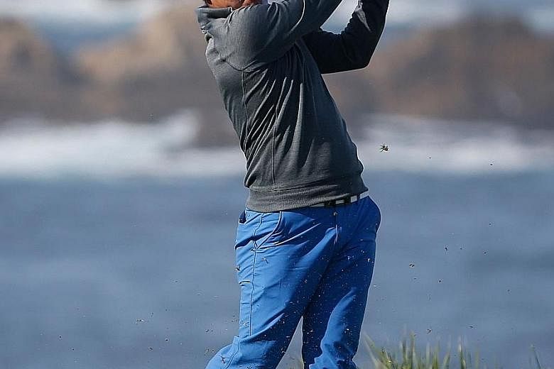 Kang Sung of South Korea playing his tee shot on the fourth hole during the first round of the AT&T Pebble Beach National Pro-Am. He narrowly missed joining the elite group of six PGA golfers with a 59 to their names. A birdie at his last hole, the p