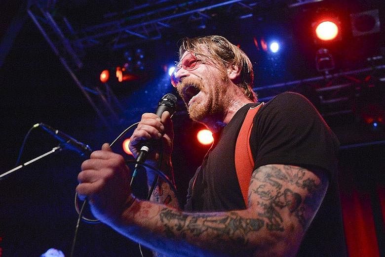 Eagles Of Death Metal performing on Nov 13 last year at Bataclan theatre in Paris, moments before gunmen stormed inside and killed 90 of the people in the audience. Frontman Jesse Hughes (above), who performed with the band in Stockholm last Saturday, sai