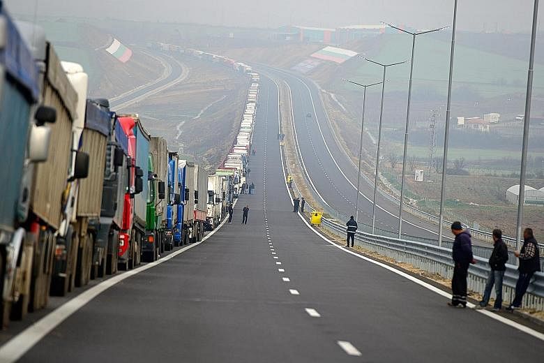 Angry Bulgarian truck drivers blocked off the country's main border checkpoint with Greece yesterday to protest against weeks of blockades by Greek farmers that intermittently disrupted traffic. The farmers have demonstrated for over a month against 