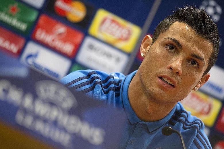 At this press conference in Rome, Real star Cristiano Ronaldo said that the off-pitch camaraderie reportedly enjoyed by Barcelona trio Lionel Messi, Luis Suarez and Neymar was over-rated. The "little meals, the little hugs, the little kisses" do not 