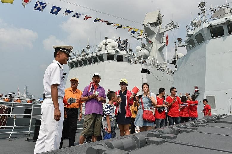 Visitors touring Chinese missile frigate Liuzhou at Laem Chabang port in Chonburi province, Thailand, yesterday. Next week, three Chinese warships carrying more than 700 Chinese sailors will be in Cambodia for a joint rescue exercise.