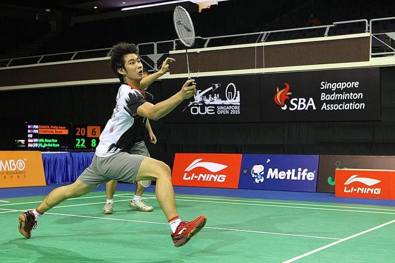 Loh Kean Yew upset Wang Zhengming and his older brother Kean Yean had a shock doubles win with partner Terry Hee.