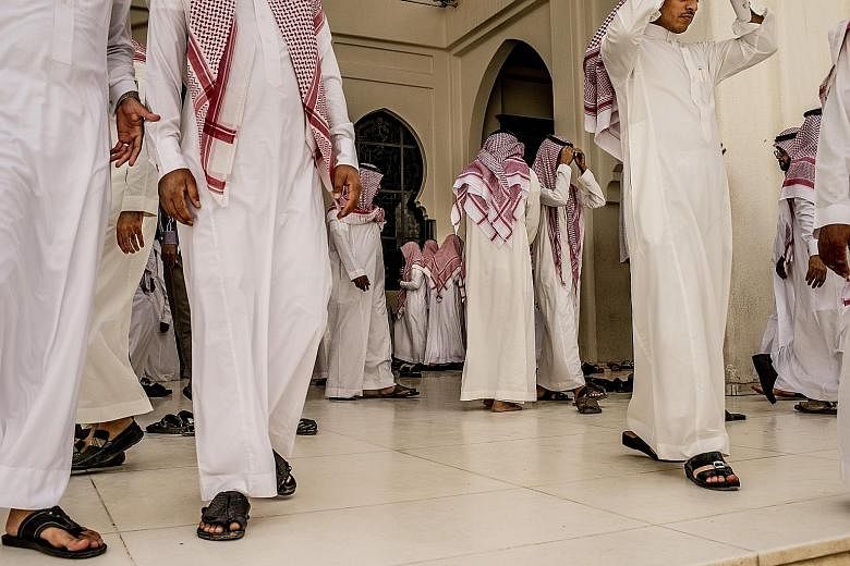 Worshippers leaving a mosque in Riyadh after prayers. For decades, the royal family has used the kingdom's immense oil wealth to lavish benefits on its people, but the plunge in oil prices is changing all that.