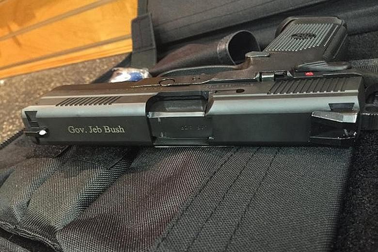 Mr Jeb Bush posted a photo of his personally engraved pistol on Twitter with the one-word caption "America". The photo attracted more than 7,000 likes.
