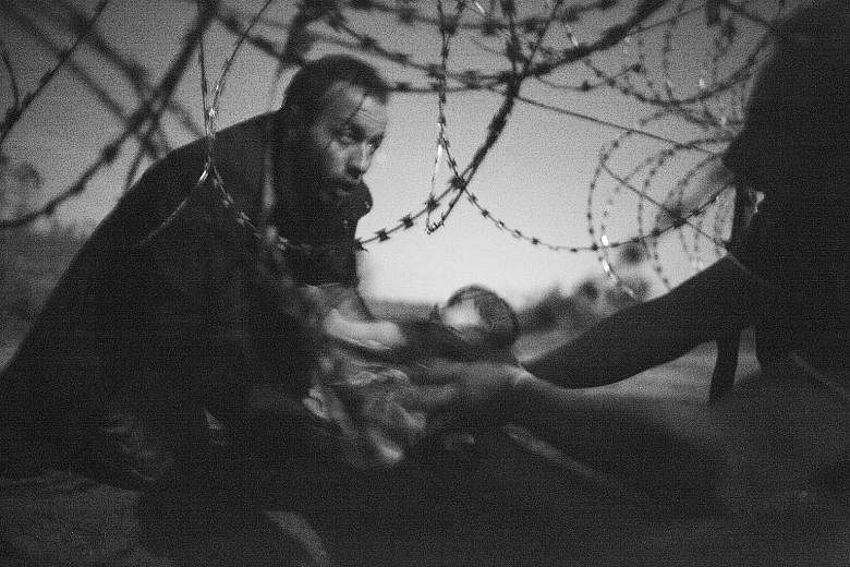 The image, titled "Hope for a new life", highlights Europe's worst migrant crisis since World War II.