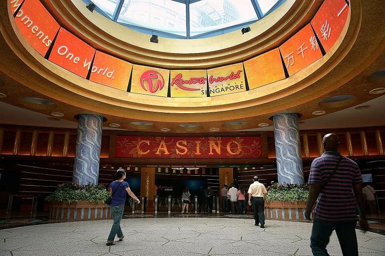 Genting Singapore, which operates the Resorts World Sentosa integrated resort (left), saw gaming revenue fall 19 per cent to $374 million as a result of lower gaming volume as the group continues to tighten its credit policy.
