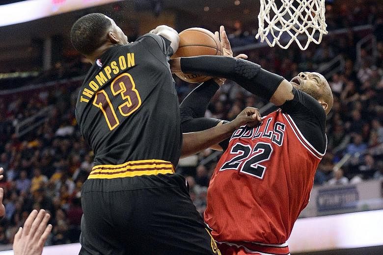 Cleveland Cavaliers centre Tristan Thompson blocking the shot of Chicago Bulls forward Taj Gibson during the third quarter at the Quicken Loans Arena. The Cavs, chasing that elusive NBA crown, won 106-95 to extend their lead atop the Eastern Conferen