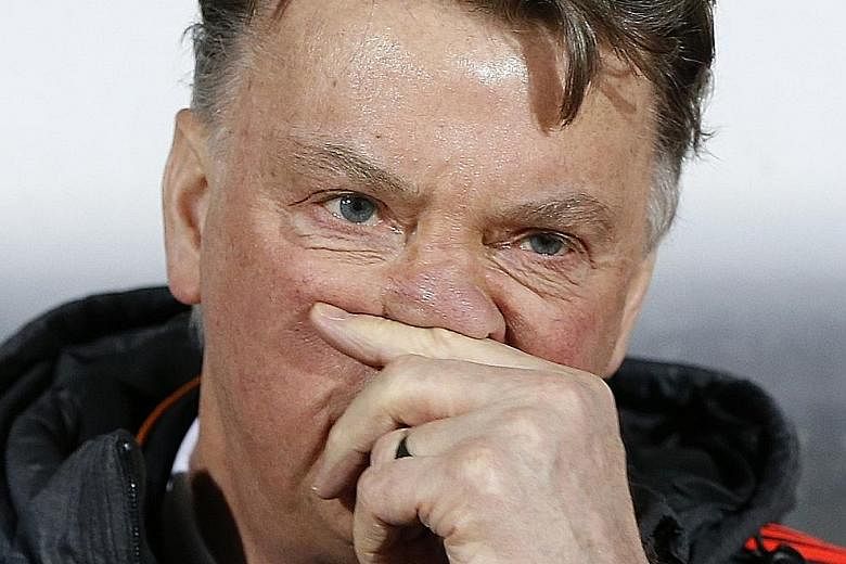 Louis van Gaal's (above) chances of staying on as Manchester United manager suffered a further blow, after Midtjylland's Paul Onuachu (right) scored the winner in their 2-1 win over the Red Devils in the first leg of their Europa League round-of-32 t
