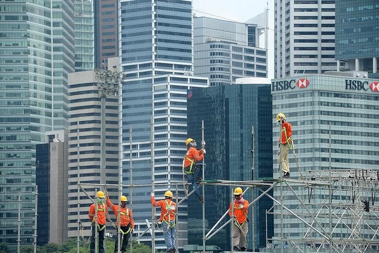 Construction workers in the Central Business District. The stock market represents real businesses with real assets. Even if a company is not profitable, it still owns assets like buildings and machinery which have a value.