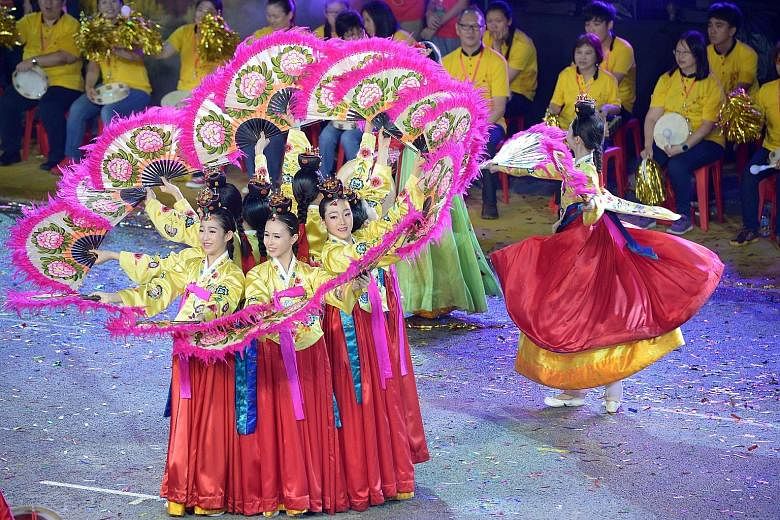 Dancers from South Korea's Yewon Dance Company dazzled the audience last night with a folk dance as part of Chingay 2016. The troupe of women, with their folding fans painted with peonies, fanned out onto the streets to create shifting symmetrical fo