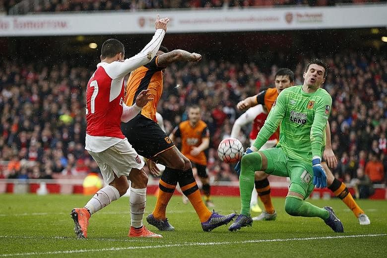 Hull custodian Eldin Jakupovic making one of his many saves, this time from Arsenal's Alexis Sanchez, during their FA Cup fifth-round clash at the Emirates Stadium.
