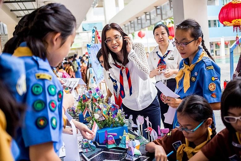 President of Girl Guides Singapore Chang Hwee Nee (centre), who was at Bedok Secondary School, and more than 5,000 members of the Girl Guides Singapore got together yesterday in their north, south, east and west divisions to mark World Thinking Day. 