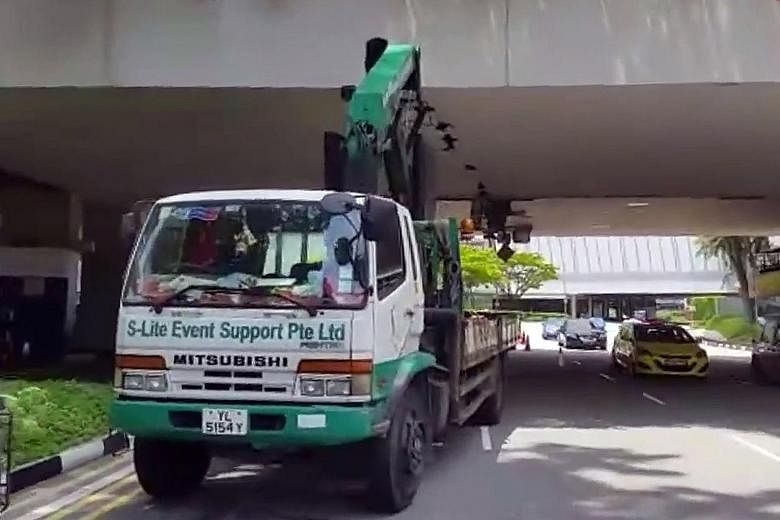 A 56-year-old lorry driver has been arrested in connection with the damage to the bottom of an overhead bridge in Raffles Boulevard. The crane boom, or lifting arm, of the lorry had allegedly caused the damage to the bridge linking Marina Square and 