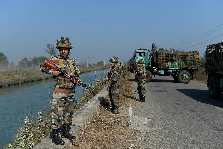 Indian security forces secure the Munak Canal - which supplies three-fifths of New Delhi's water needs for its more than 20 million people - in Haryana's Sonipat district. Delhi's water board said there is extensive damage to the canal and it will ta