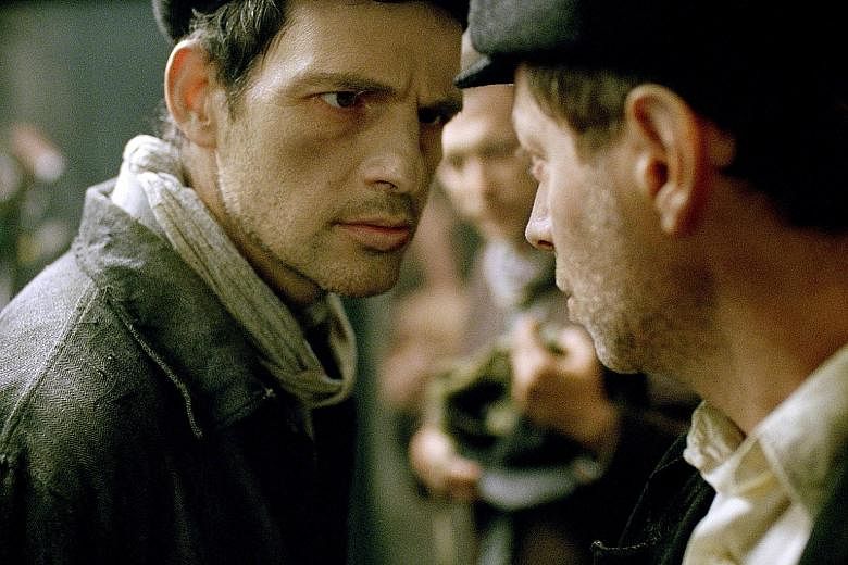 In Son Of Saul, Hungarian actor Geza Rohrig (far left) plays Saul Auslander, a Jew who is selected to herd his own kind into the death chambers in Auschwitz.