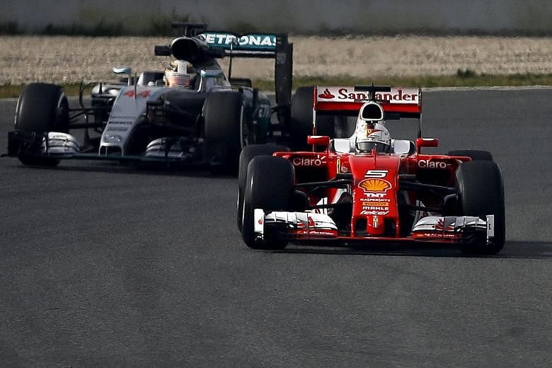 Sebastian Vettel (front) will be hoping that his Ferrari race car will stay ahead of Lewis Hamilton's Mercedes when the new F1 season begins next month.