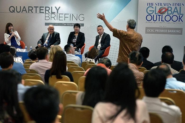 (From left) Straits Times foreign editor Audrey Quek, Mr Desker, OCBC's head of treasury research and strategy Selena Ling and Mr Chan during the question-and-answer session yesterday at the first quarterly briefing leading up to the annual Global Ou