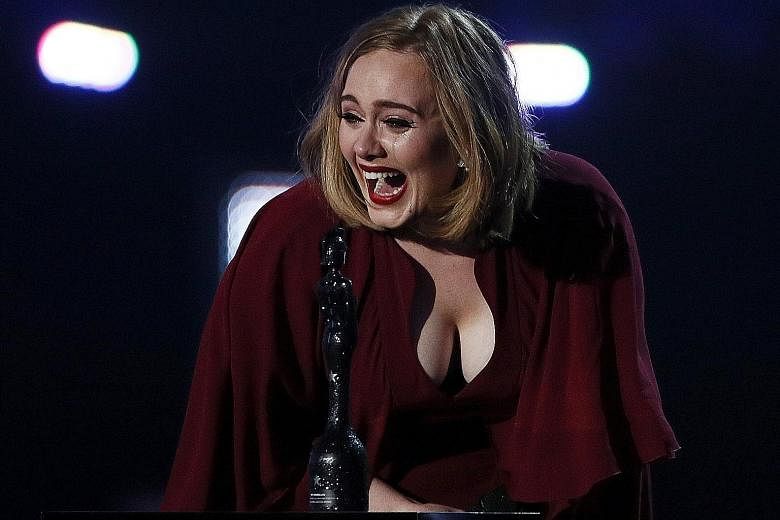 Adele accepting her Global Success award.