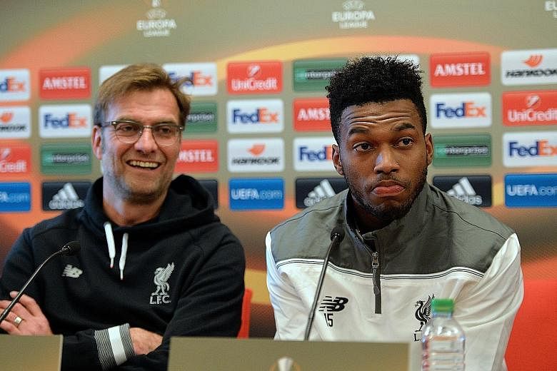 Liverpool manager Juergen Klopp (left) addressing the media alongside Daniel Sturridge. The striker is keen to make up for lost time after dismissing rumours he has missed games for religious reasons.