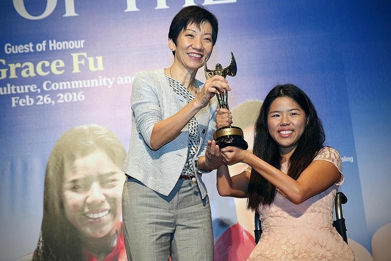 Para-swimmer Yip Pin Xiu, 24, receiving her Straits Times Athlete of the Year award from Minister for Culture, Community and Youth Grace Fu yesterday. The world record-breaker and Asean Para Games champion edged out Shayna Ng (bowling), Shanti Pereir